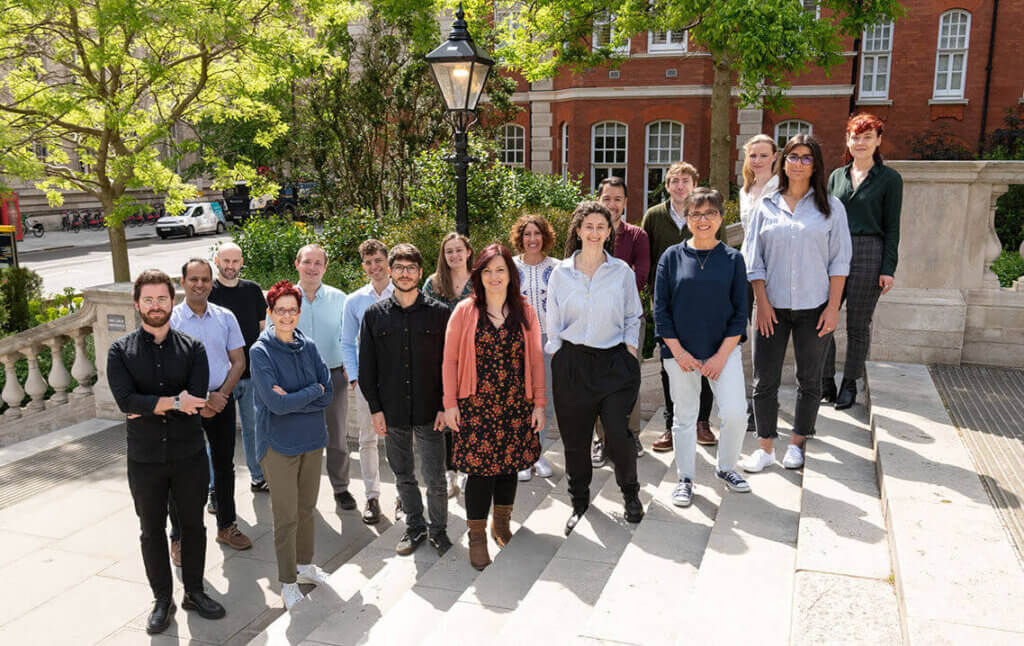 Group photo of 17 team members at Imperial College London.