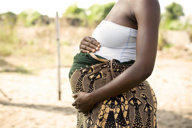 Pregnant lady with cloth around belly