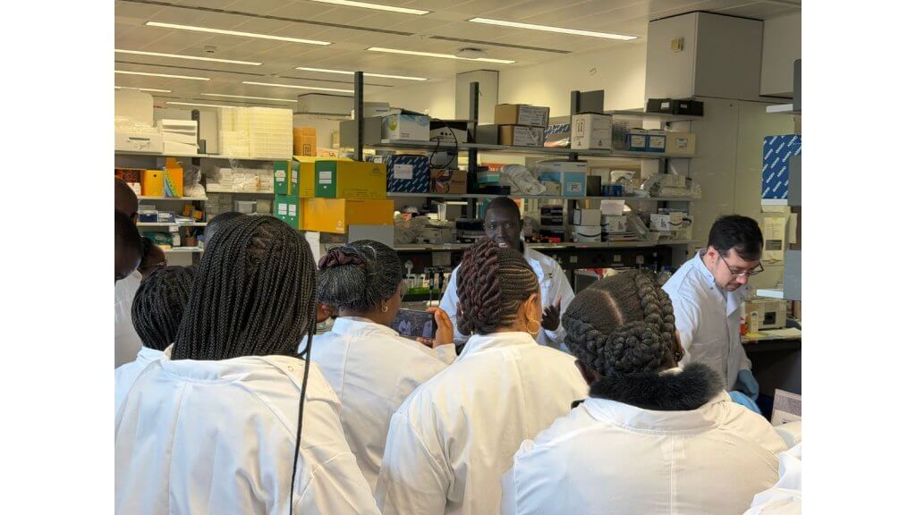 Target Malaria UK Research Technicians Lee Phillimore and Lamin Jadama discuss lab work with the journalists
