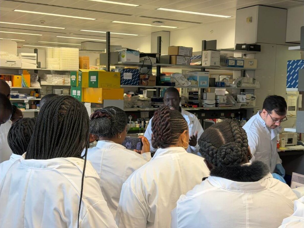 Target Malaria UK Research Technicians Lee Phillimore and Lamin Jadama discuss lab work with the journalists