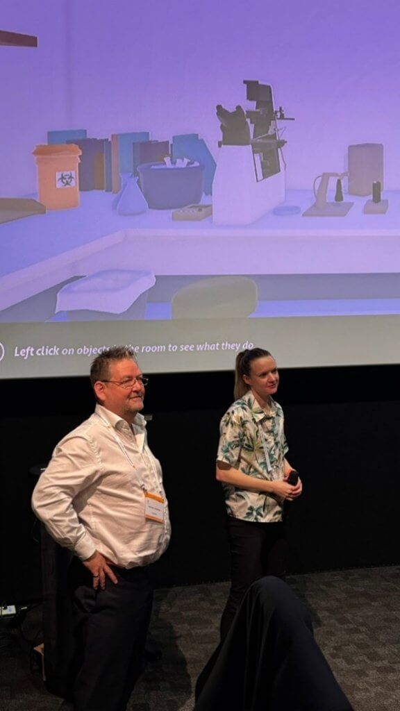 Louise presenting and discussing Target Malaria The Game with the
Games for Health Europe Founder, Jurriaan van Rijswijk (left), Louise (right).
Credit: Games For Health Europe